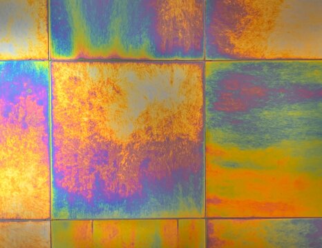 Iridescent titanium texture with colorful anodic oxidation finish.