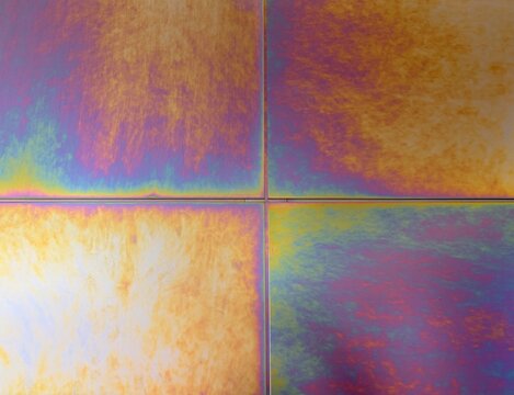 Iridescent titanium texture with colorful anodic oxidation finish.
