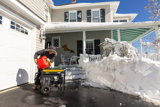 Man operating generator home after storm 