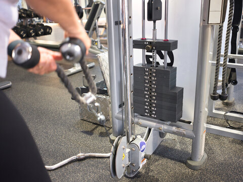 Weight Training Session at the Gym With Cable Machine and Weights