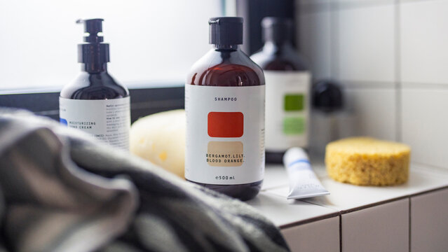 Shampoo Bottle and Toiletries on Bathroom Counter