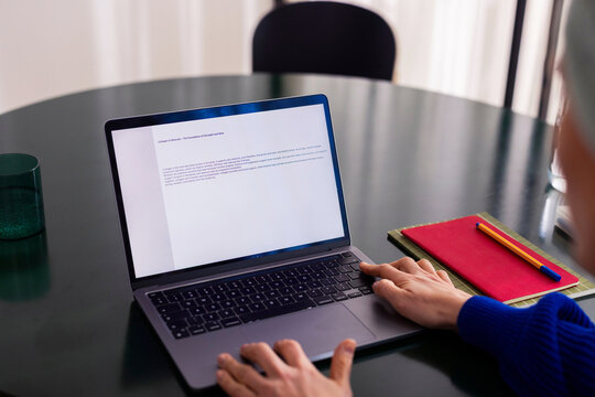 Remote Work On Laptop With Notebook And Pencil