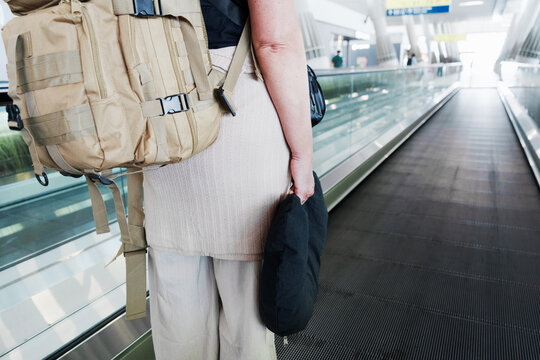 Travelers gliding through airport passage