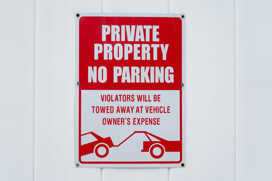 Red and white regulatory sign in city environment