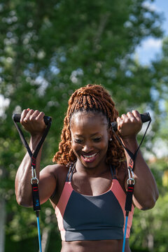Woman enjoying outdoor resistance band workout