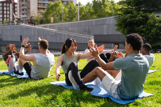 Outdoor group fitness class enjoying workout together