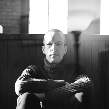 Frontal portrait of a pensive man.