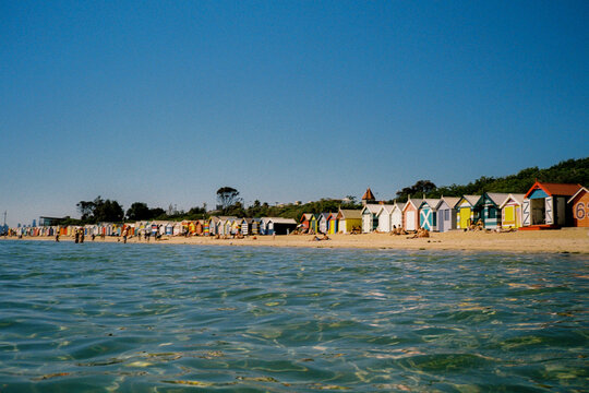 Vibrant bathing boxes on Brighton beach in Melbourne, Australia. Film 