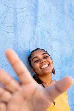 Happy Afro-Brazilian Woman Reaching for the Camera