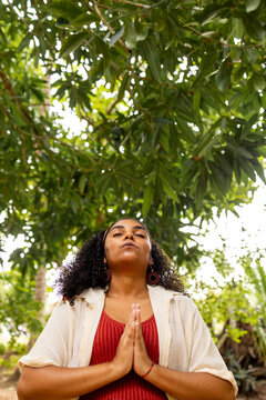 Woman Framed by Palm Leaves