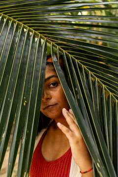 Woman Framed by Palm Leaves