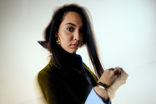 Elegant woman facing the camera in studio
