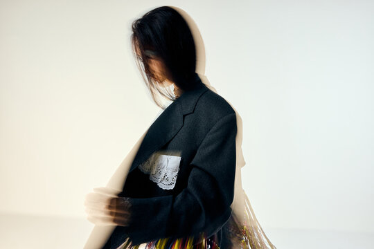 Blurry woman in an unusual outfit