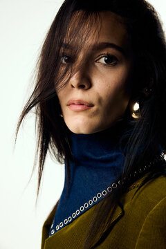 Beautiful woman facing the camera in studio