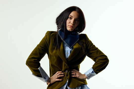 Modern woman wearing blazer in studio