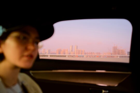 Traveling Through Shanghai at Sunset From a Car Window