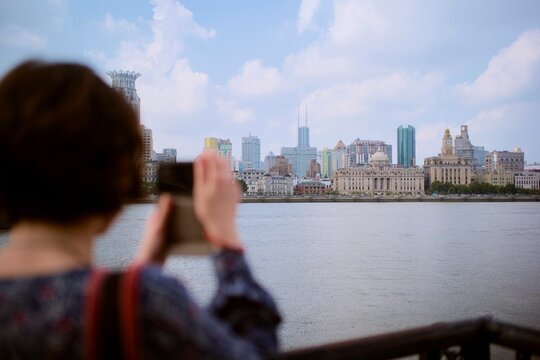 Enjoying the Skyline View of Shanghai While Taking a Picture