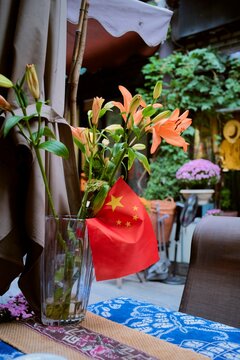 Travel Experience in China With Flowers and Flag Decoration