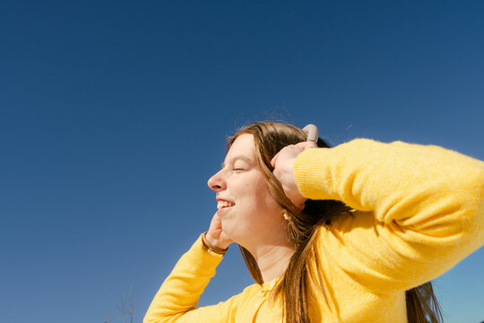happy young woman listening to music