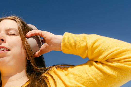 young woman listening to music