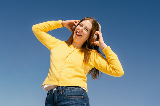 happy young woman listening to music