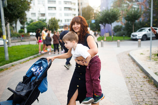 mother with children walking in the city