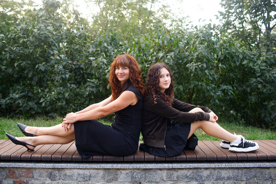 mother with daughter walking in the park