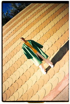 Film photo of model posing colorful outfit