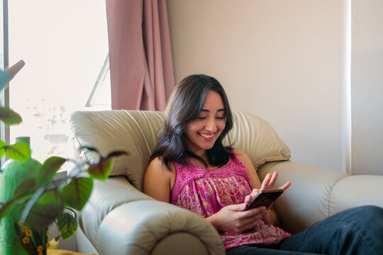 Woman Using Smartphone at Home
