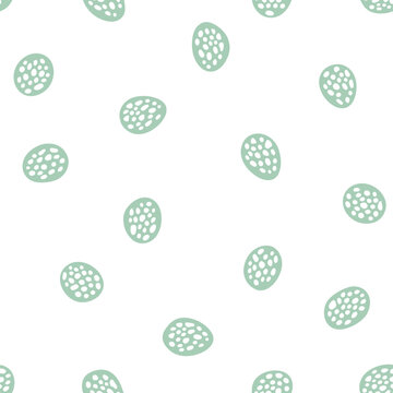 Minimalist seamless pattern featuring scattered handdrawn teal textured oval shapes.