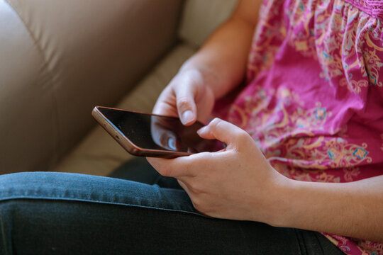 Person Using Smartphone at Home