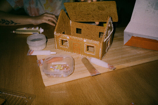 Assembling gingerbread house on Christmas 