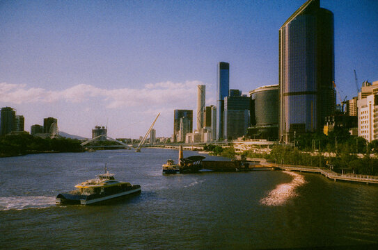 Ferry on the background of Brisbane cityscape 