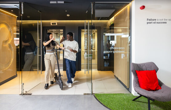 Young coworkers sharing a positive moment in the office