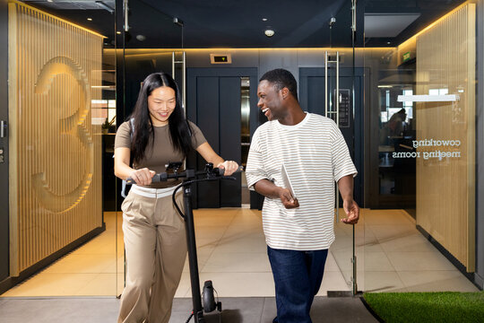 Colleagues enjoying a lighthearted moment at the office