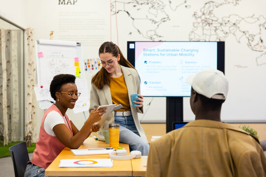 Diverse gen-z team collaborating in modern office setting