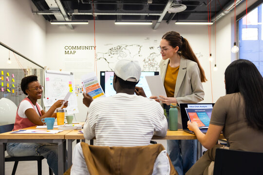 Diverse team of gen-z professional collaborating in creative meeting 