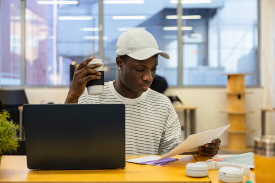 Focused student studying at desk in library setting