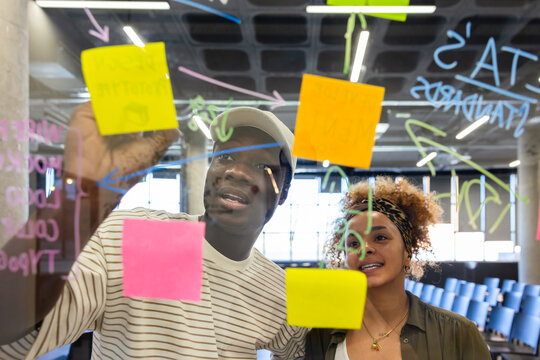 Team collaboration with colorful sticky notes brainstorming