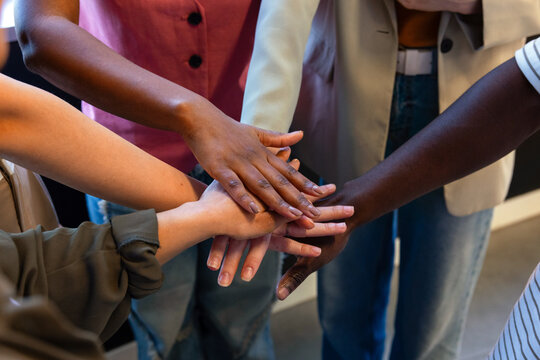 Diverse hands joined together symbolizing unity