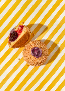 Sweet Treats on a Yellow Striped Background With a Fruit Filling