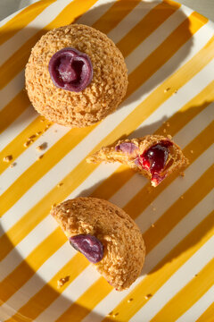 Sweet Treats on a Yellow Striped Background With a Fruit Filling