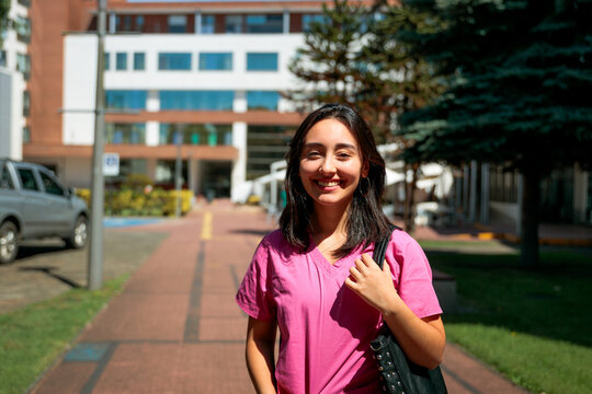 Healthcare professional smiling on campus