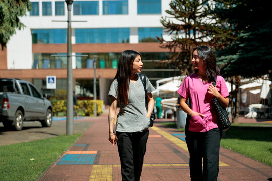 Healthcare professionals walking on campus