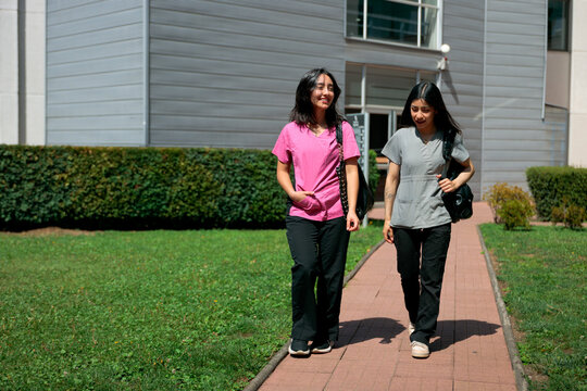 Medical trainees walking on campus
