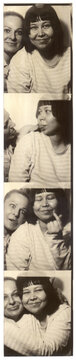 Black and White Photo Booth Strip with Two Friends Posing