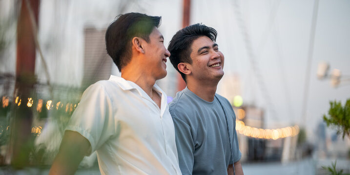 Gay couple enjoying date together, happiness, and connection outdoors