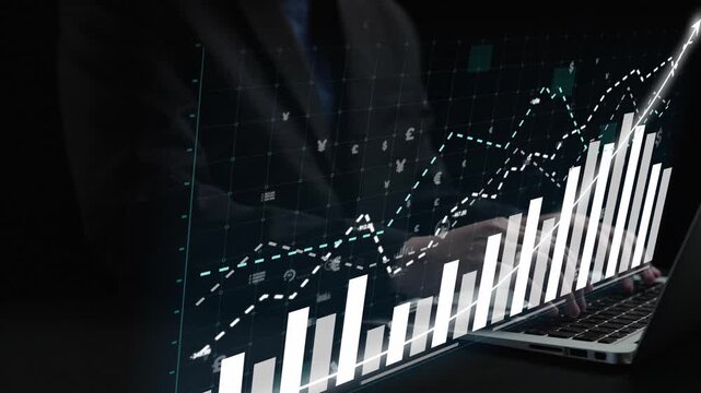 A professional man interacts with a laptop while analyzing dynamic growth graphs in a modern workspace. Ideal for visualizing business strategies and financial trends. Copula