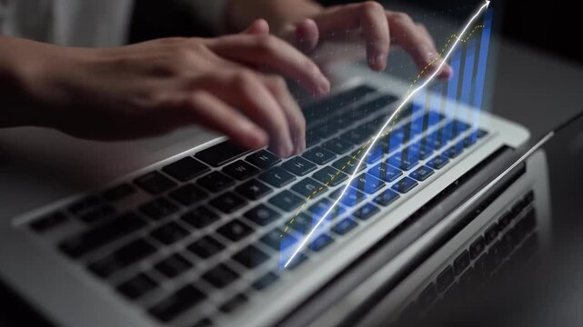 An engaging close-up of hands on a laptop keyboard showcasing digital projections, symbolizing modern technology and analysis in a professional workspace. Copula