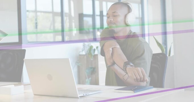 Office worker at laptop glancing wrist checking watch stretching purple or green streaks sweeping de